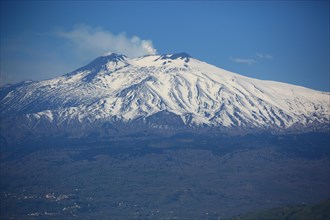 The snow-capped peak of Etna volcano