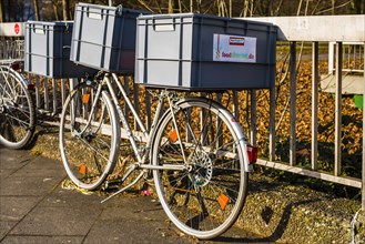 Bicycle with plastic containers from foodsharing