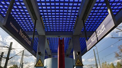 Platform with roof of blue glass blocks and fair-faced concrete