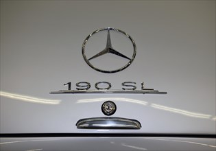 Logo emblem Mercedes star on historic sports car classic car Mercedes 190 SL
