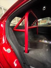 View into the rear of the car Interior of the car with removed rear seat Roll-over bar Trough for helmet storage of limited edition 500 Italian sports car Alfa Romeo Giulia GTAm