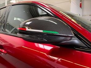 Rear view mirror with carbon fairing with coloured stripes of Italian national colours national flag Tricolore of limited edition 500 pieces Italian sports car Alfa Romeo Giulia GTAm
