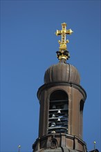 Spire with carillon and golden cross from the Christuskirche