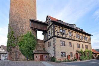Historic back tower built in 1587 and half-timbered house in Schlitz