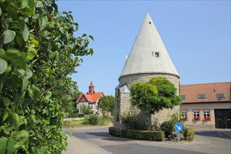 Historic fortified defence tower as traffic island