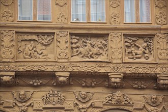 House wall with wood carving and ornaments with year at Krummelsches Haus built 1875