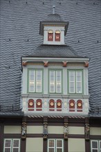 Dormer with figures on the roof of the town hall