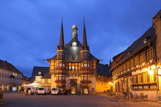Landmark town hall and street pub with lighting at night