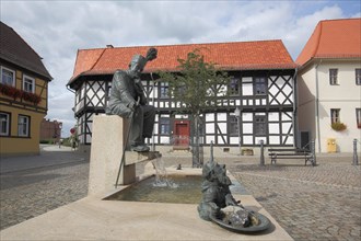 Market place with fountain and figures