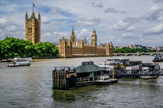 Excursion boat on the Thames with Parliament House and Victoria Tower
