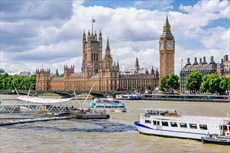 Excursion boats on the Thames with the Houses of Parliament and the clock tower Big Ben