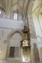 Pulpit and painted knight's tomb in the church of Nanebevzeti Panny Marie