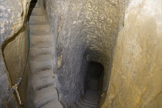 Staircase carved out of the sandstone inside the rock castle Valecov