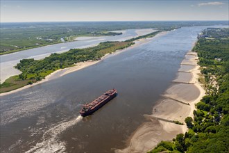 Aerial view of a cargo ship in the shipping channel of the Elbe near Blankenese in the direction of the North Sea. Right picture: Wedel power station