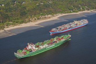 Aerial view of two container ships in the meeting box of the Elbe at the Falkenstein bank
