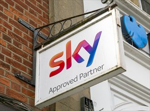 Sky Approved Partners wall hanging sign outside shop