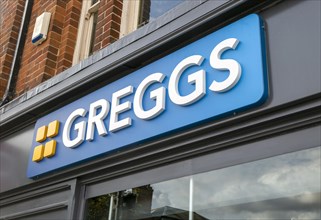 Sign above Greggs bakery shop