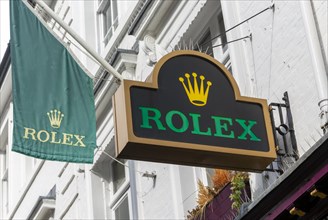 Rolex advertising sign and banner flag outside jeweller shop