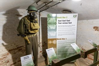 Display information 1940s mannequin in uniform wearing gas mask