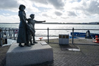 A monument by Jeanne Rynhart to Annie Moore from Cork who was the first immigrant to pass through Ellis Island. Cobh