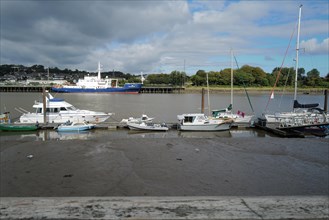 A view of ships and boats in the maritime port of Waterford on a sunny day. Waterford