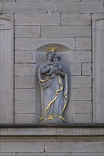 Sculpture of Maria Immaculata on a house facade around 1850