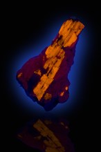 Wollastonite in Calcite Fluorescing in Ultra Violet Light