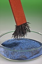Bar Magnet Separating Iron Filings from a Mixture with Copper Sulphate