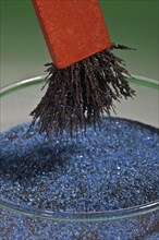 Bar Magnet Separating Iron Filings from a Mixture with Copper Sulphate