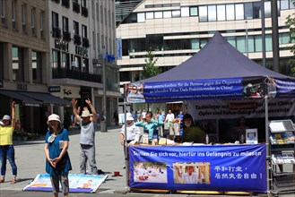 Information stand for a petition against organ theft in China