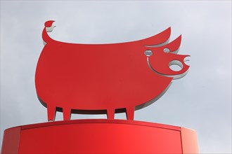 Advertising figure in the shape of a happy pig