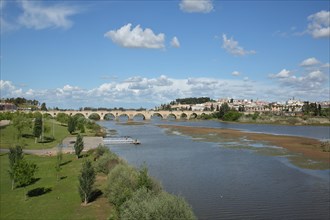 View of Puente de Palmas built 15th century over the Rio Guadiana with townscape of Badajoz
