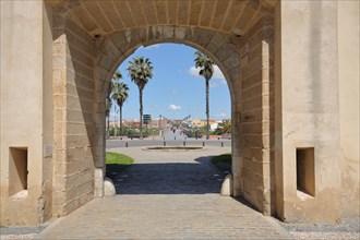View through the Puerta de Palmas gate of historic Puente de Palmas in Badajoz