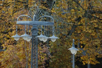 Historic streetlamp in the autumnal spa garden
