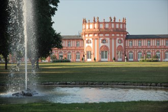 Castle park with fountain of Biebrich Castle in Biebrich