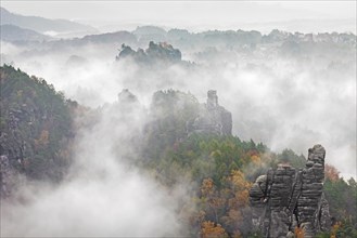 View over the Raaber Kessel in the mist in the Elbe Sandstone Mountains
