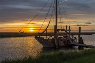 Sunrise with sailing ship at Suederhafen