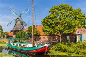 Gallery windmill with canal boat in Ostgrossefehn