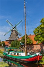 Gallery windmill with canal boat in Ostgrossefehn