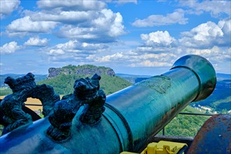 Historical cannon on the parapet and view across to the Lilienstein