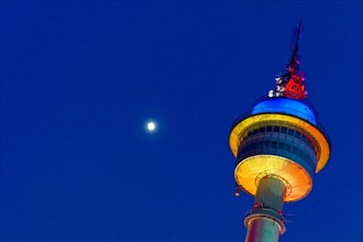 Colourfully illuminated radar tower