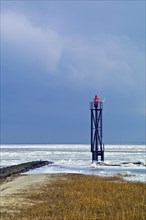 Lighthouse at the harbour entrance of Fedderwardersiel