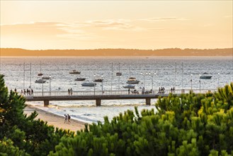 Boats and jetty in Arcachon Bay in the evening light