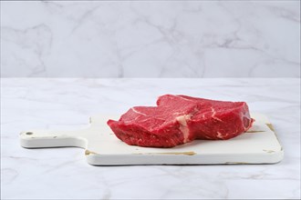 Slice of raw top side beef steak