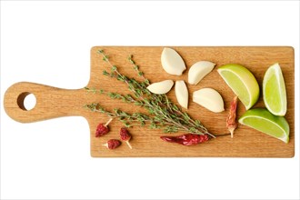 Top view of wooden cutting board with garlic