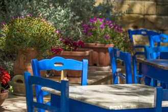 Blue tables and chairs in a cafe