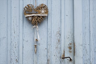 Heart on an old wooden door as decoration