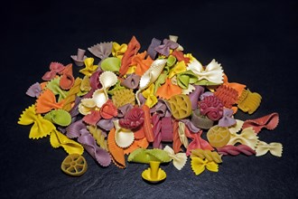 Colourful pasta in different shapes