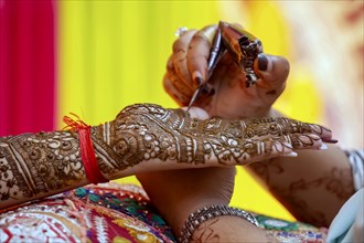 Beautiful henna design on the hand of a Hindu bride on her wedding eve