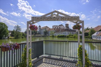 View over pond to castle with lettering